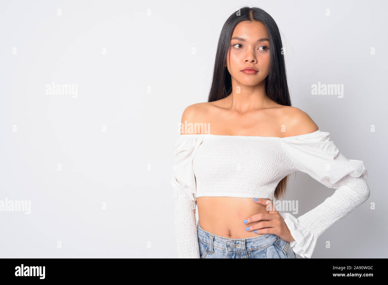 Portrait of young beautiful Asian woman thinking Stock Photo - Alamy