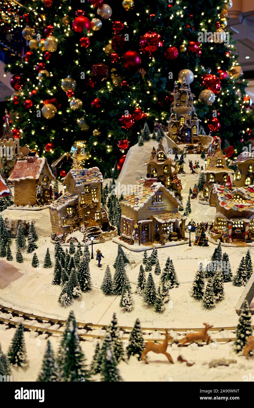 Snowy village diorama decorated with Christmas celebrations Stock Photo