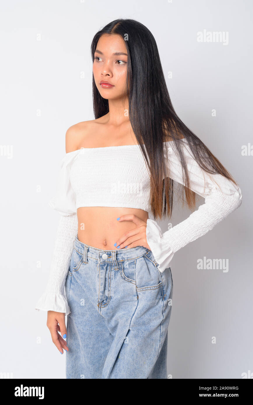 Portrait of young beautiful Asian woman thinking Stock Photo - Alamy