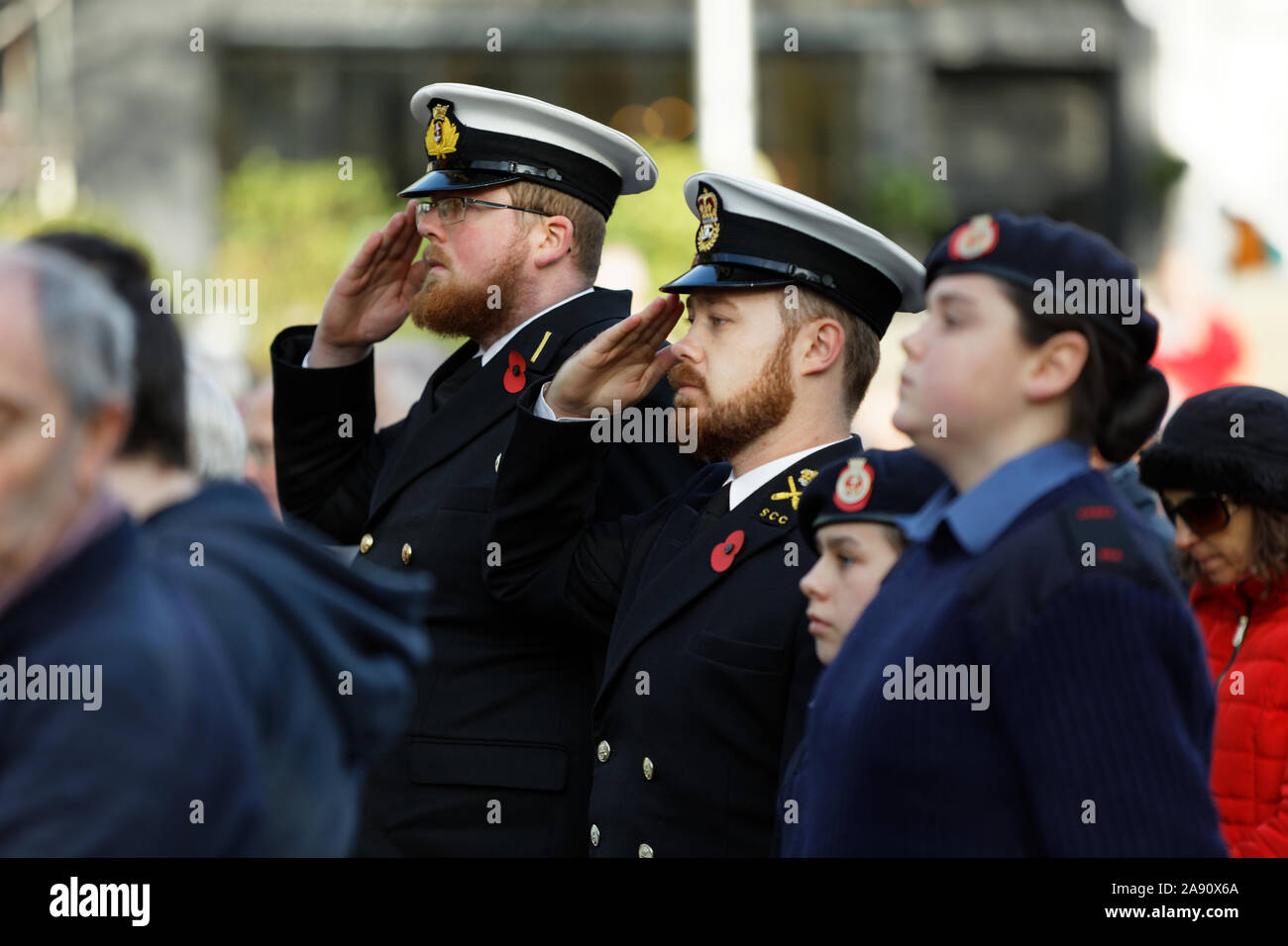 Swansea, UK. 11th Nov, 2019. Pictured: Two members of the armed forces observe two minutes silence at Castle Square Gardens in Swansea, Wales, UK. Monday 11 November 2019 Re: Armistice Day, a service to commemorate those who lost their lives in conflict has been held at Castle Square Gardens in Swansea, Wales, UK. Credit: ATHENA PICTURE AGENCY LTD/Alamy Live News Stock Photo