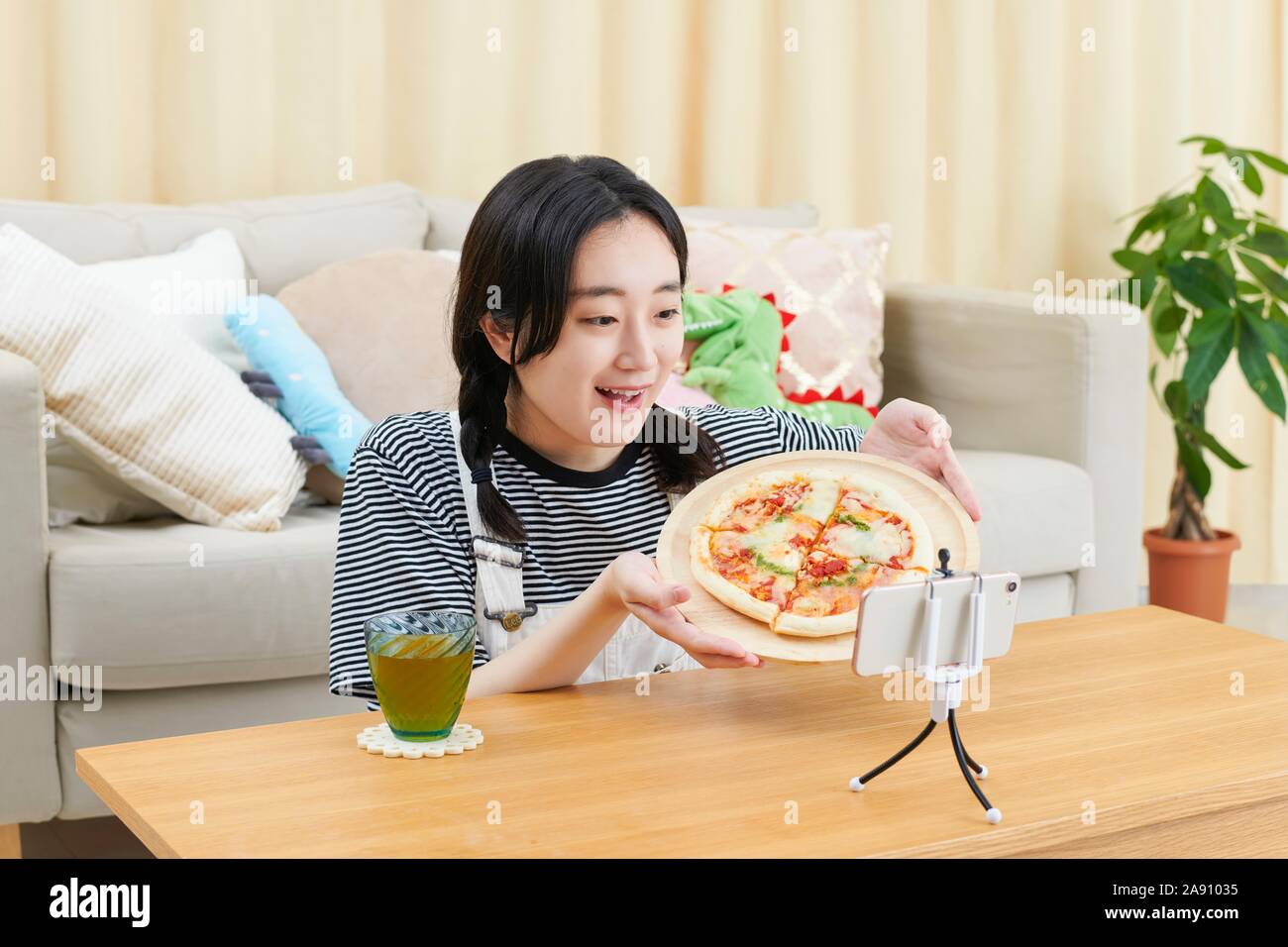 Young Japanese youtuber streaming at home Stock Photo