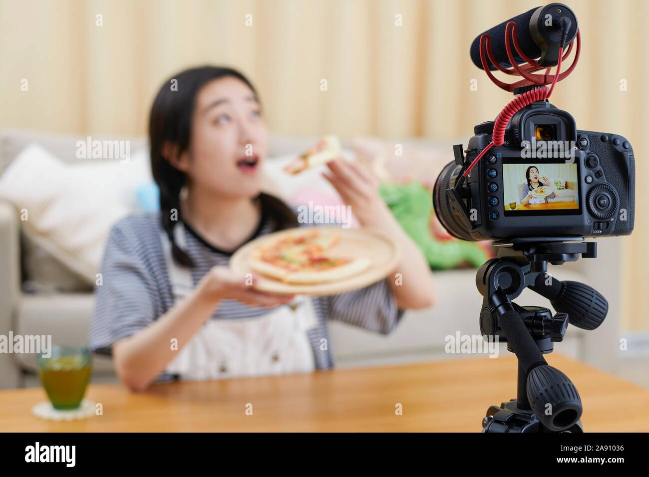Young Japanese youtuber streaming at home Stock Photo