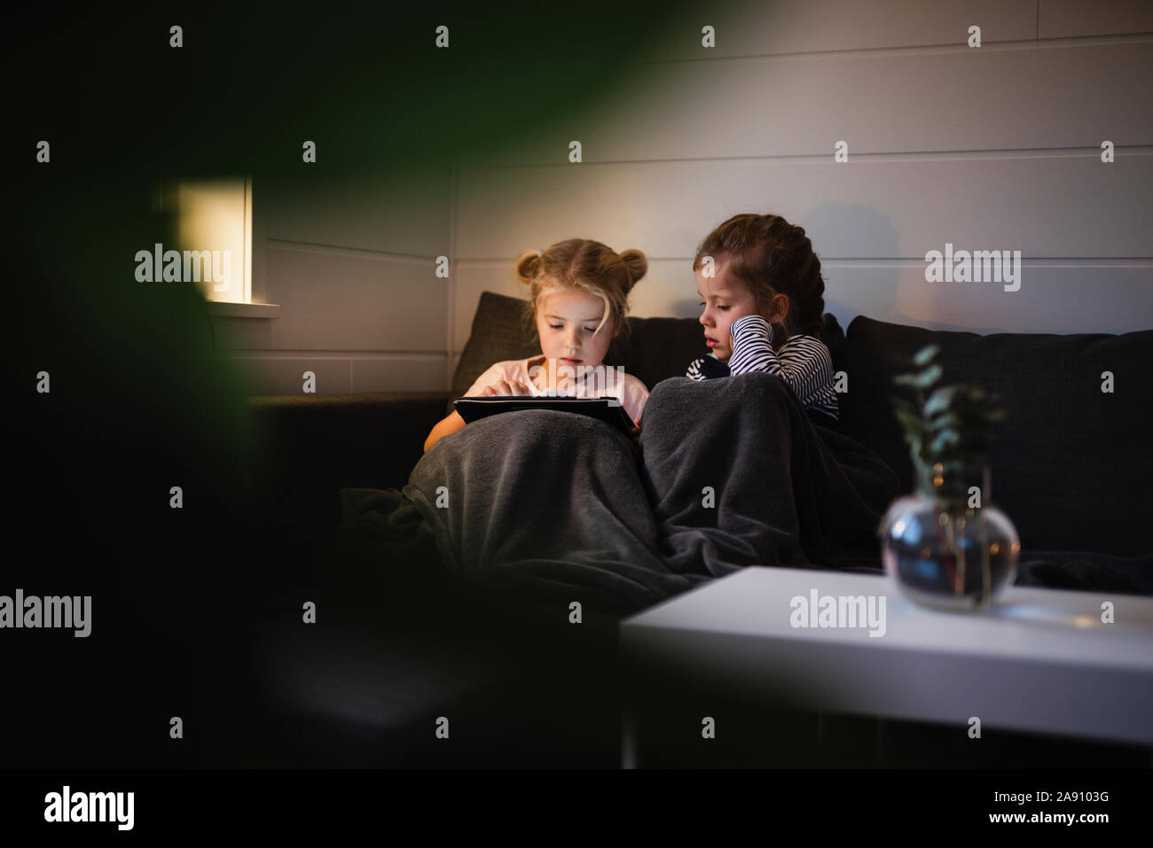 Girls using digital tablet Stock Photo
