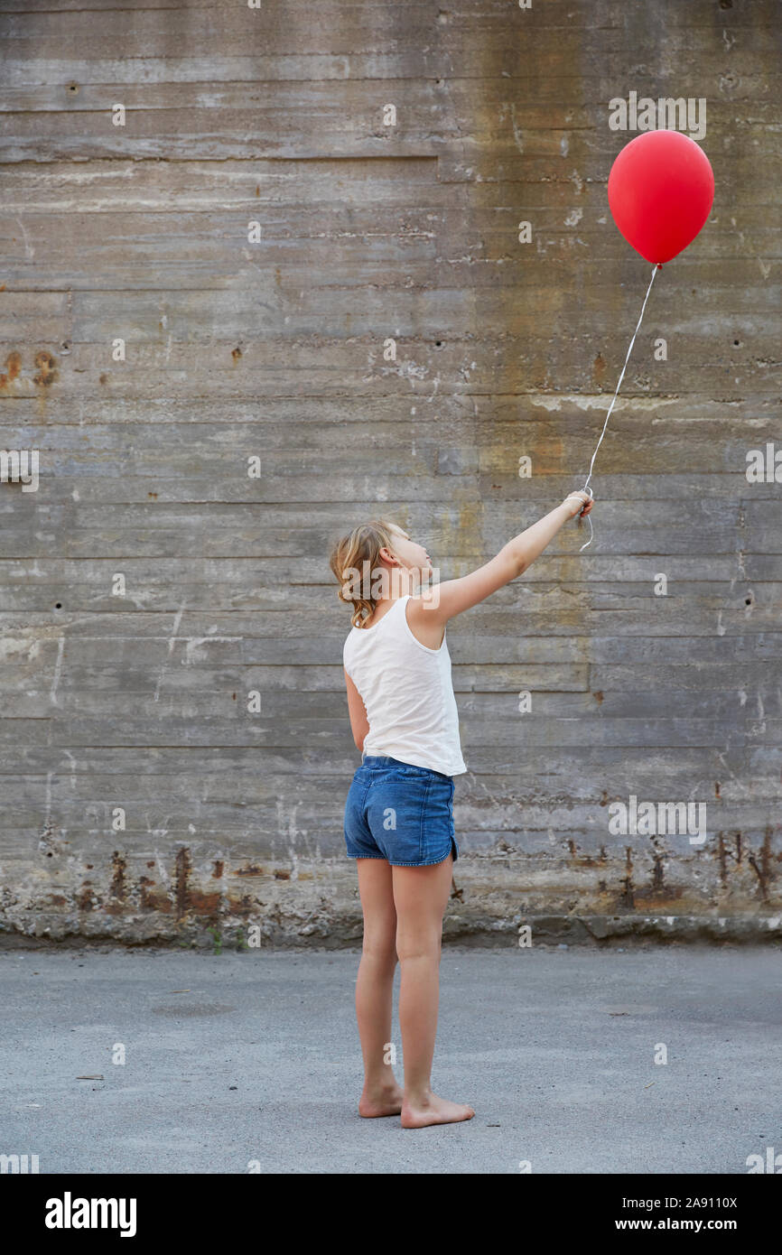 Girl with red balloon Stock Photo - Alamy