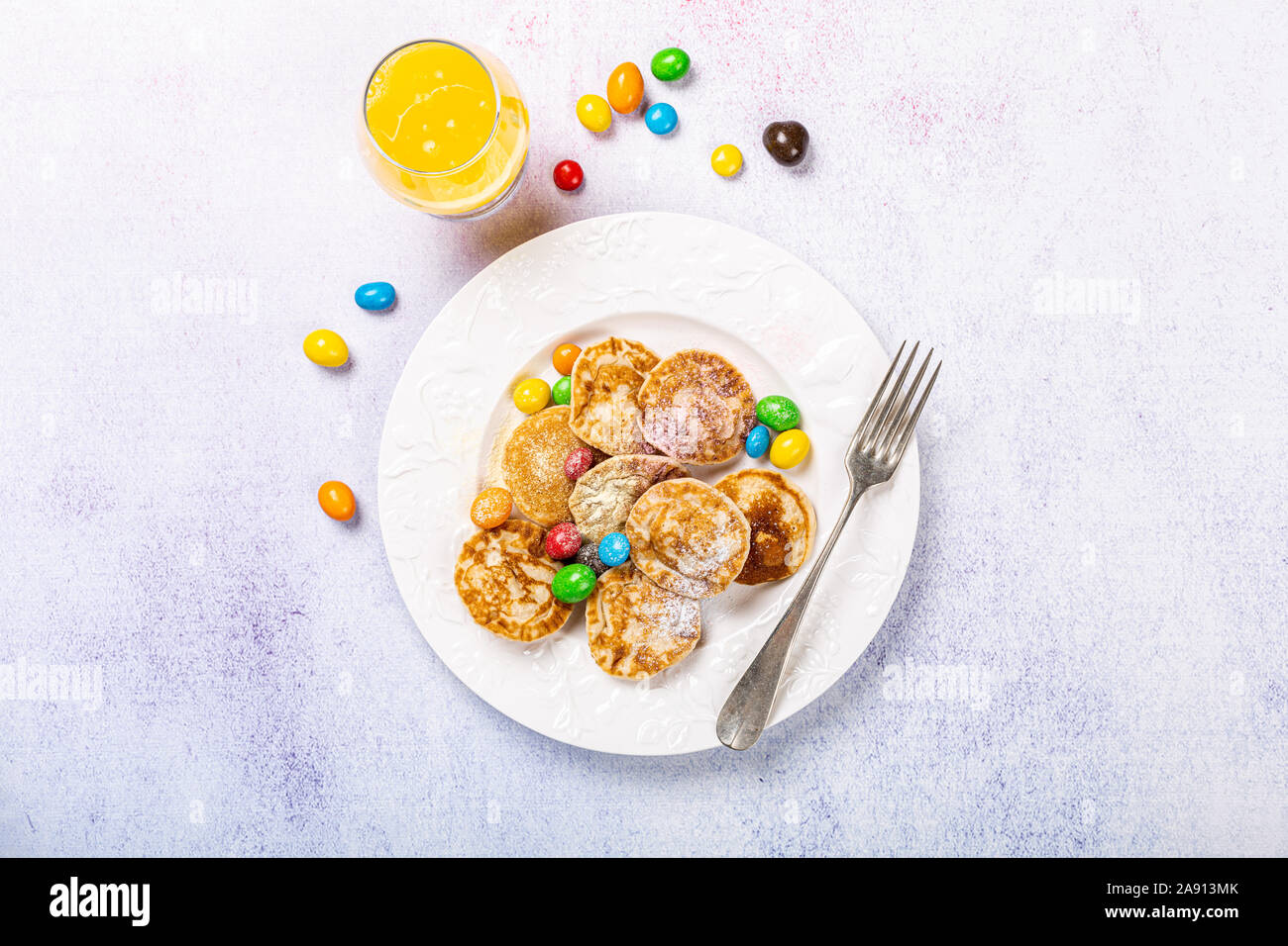 Dutch mini pancakes called poffertjes Stock Photo