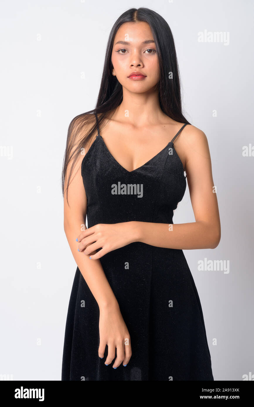 Portrait of young beautiful Asian woman looking at camera Stock Photo ...