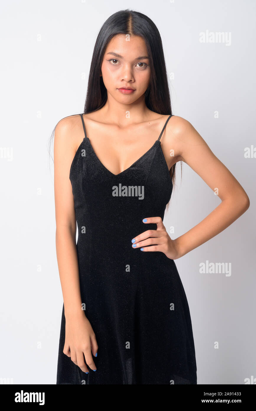 Portrait of young beautiful Asian woman looking at camera Stock Photo ...