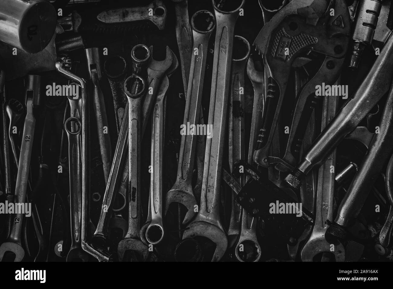 Pile of old wrench. Mechanic tools. Closeup set of spanner in tool box. Chrome wrench at garage workshop. Equipment for repair car or motorcycle. Hard Stock Photo