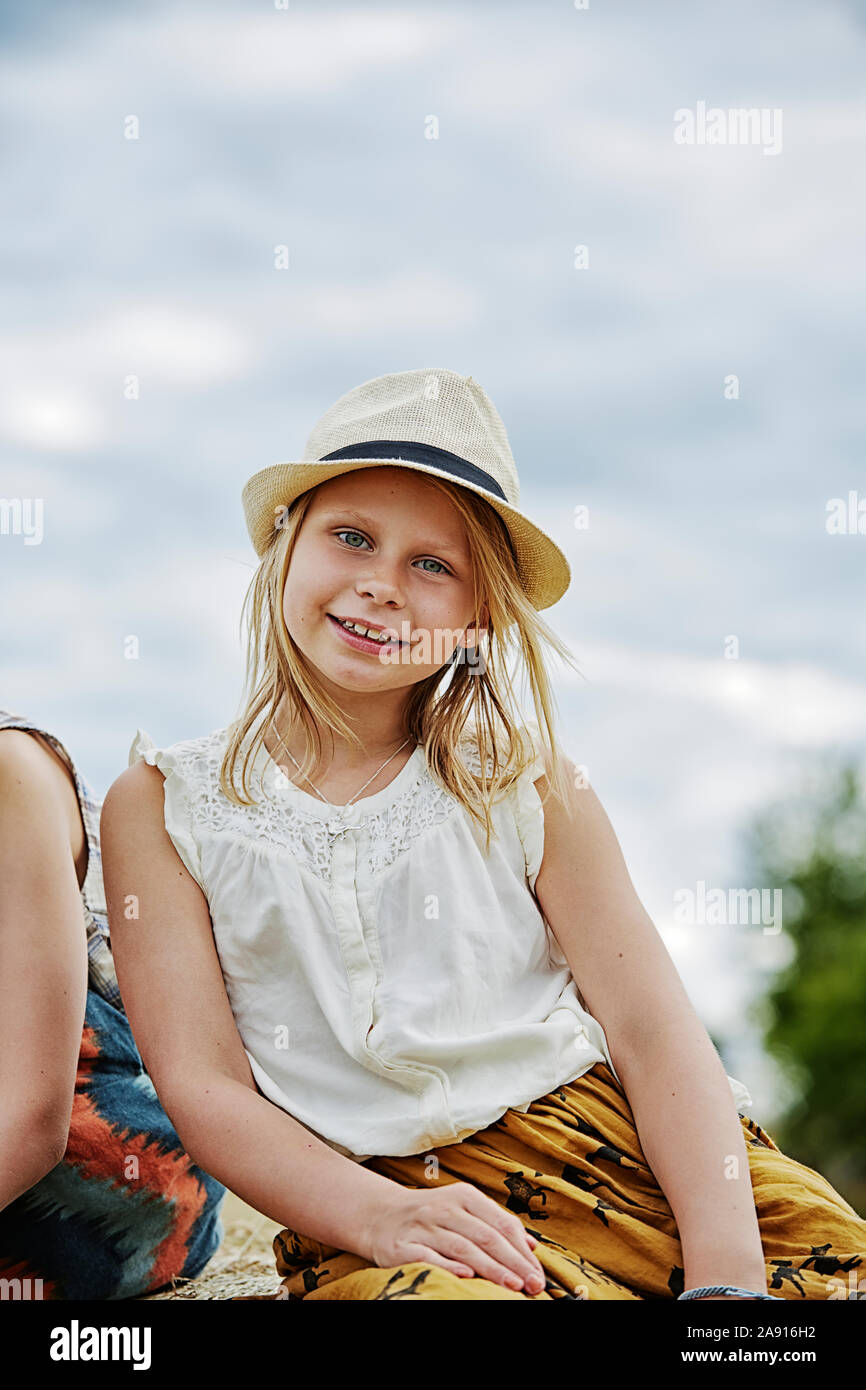 Smiling girl looking at camera Stock Photo - Alamy