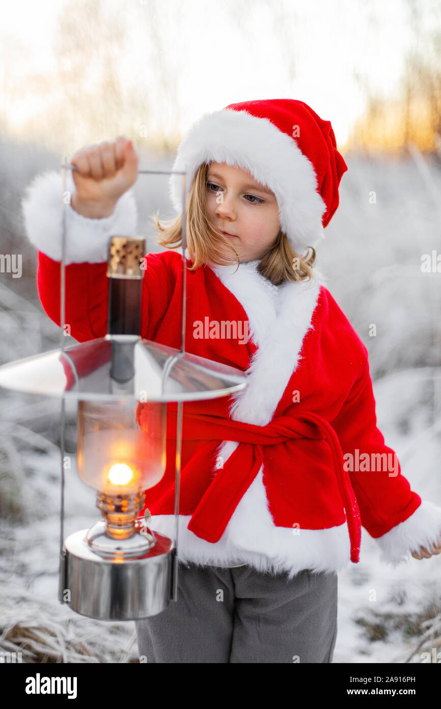 Girl wearing Santa clothes at winter Stock Photo