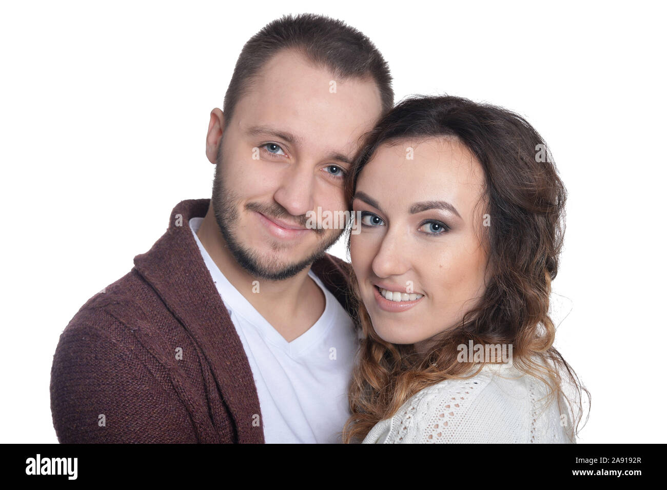 Happy young couple isolated on white background Stock Photo - Alamy