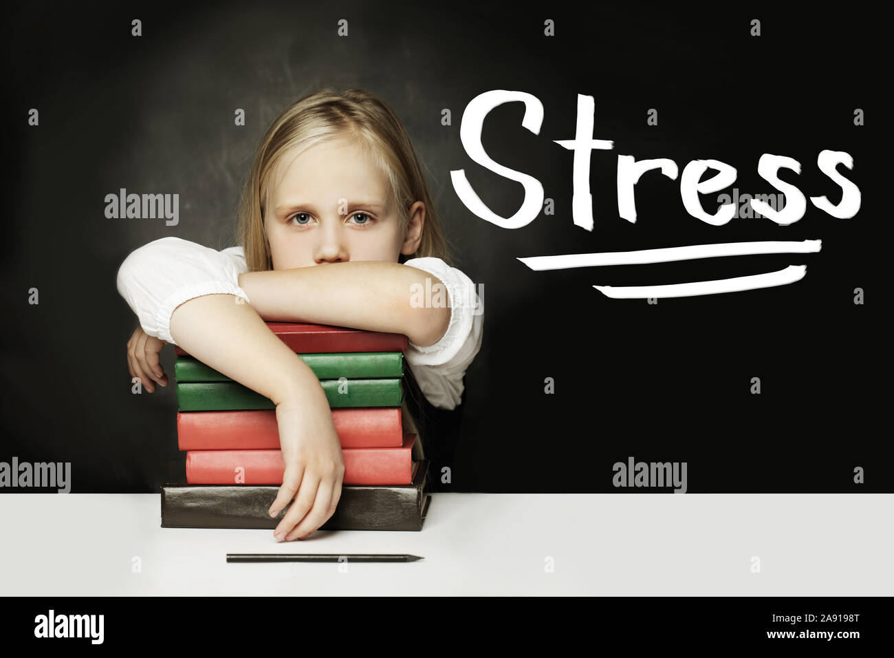 Sad Tired child with books. Stress concept Stock Photo