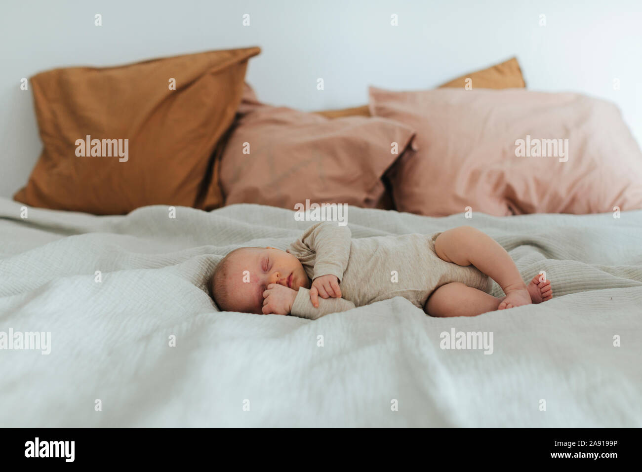 Baby sleeping on bed Stock Photo Alamy