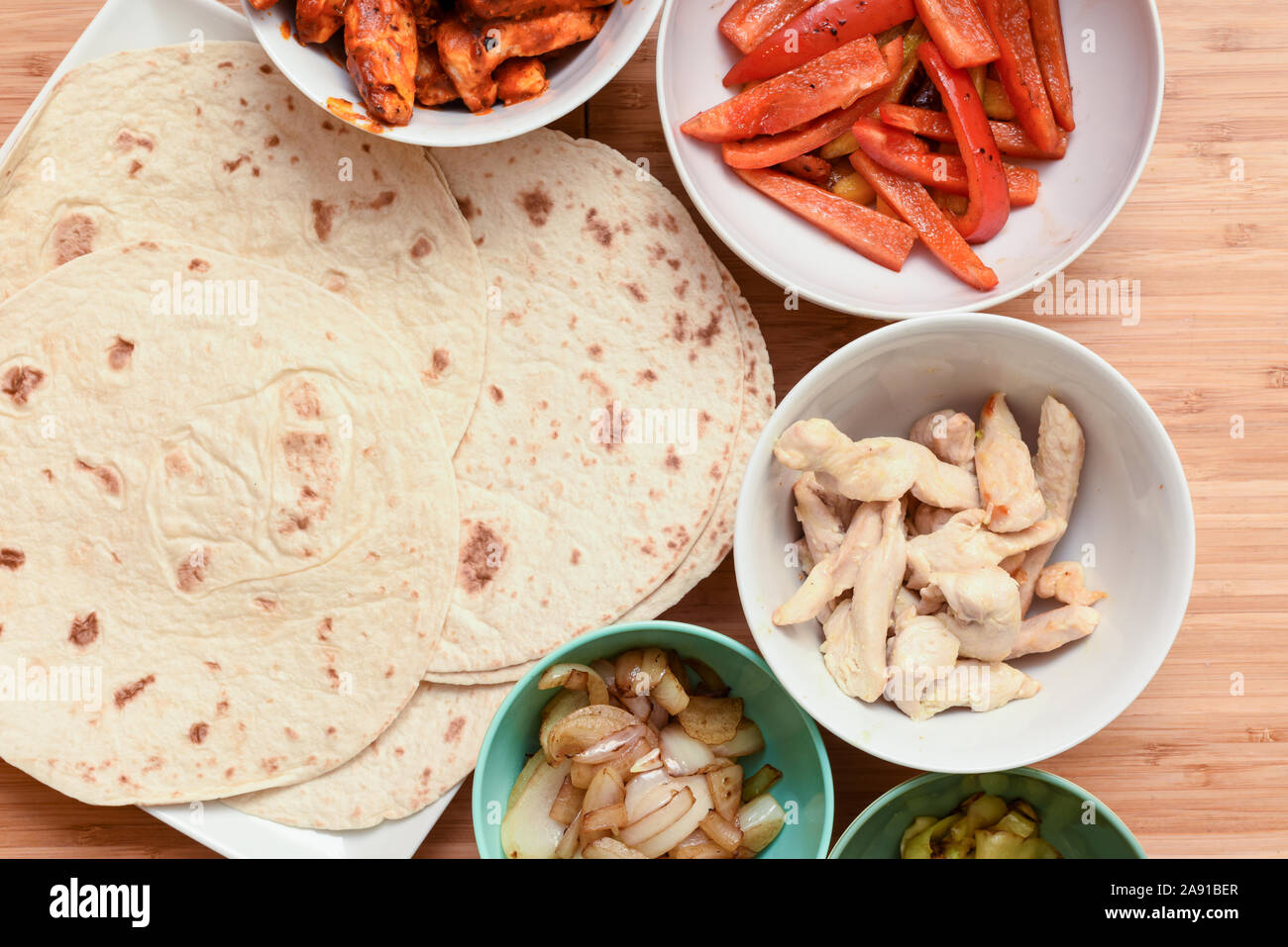 Selection of mexican food ingredients to add to soft flour tortilla at mealtime Stock Photo