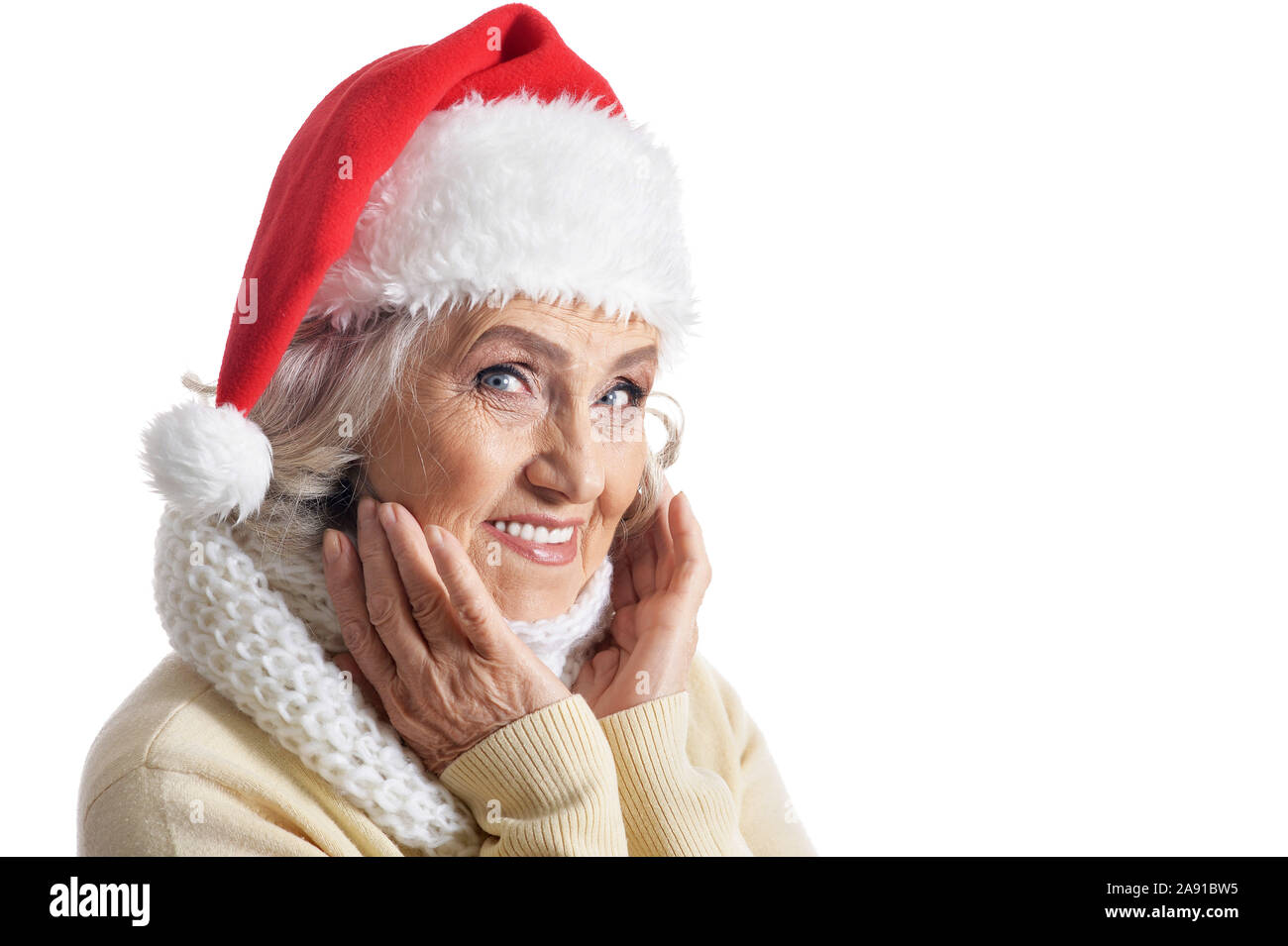 Portrait of senior woman in Santa hat isolated Stock Photo - Alamy