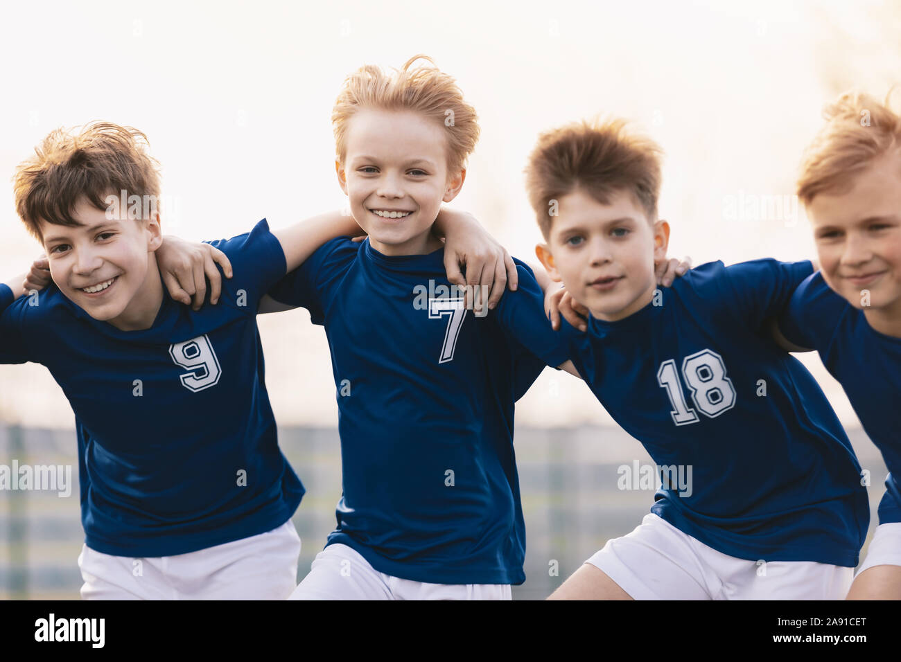 Happy Friends on a Soccer Team. Boys Sports Players Having Fun. Kids Soccer Players Cheering Together Stock Photo