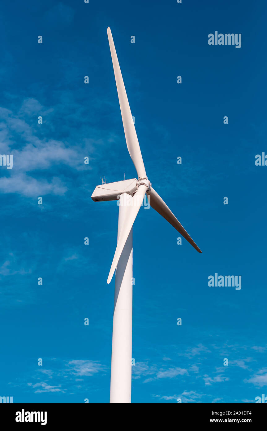 Electric wind turbine with clear blue sky Stock Photo - Alamy
