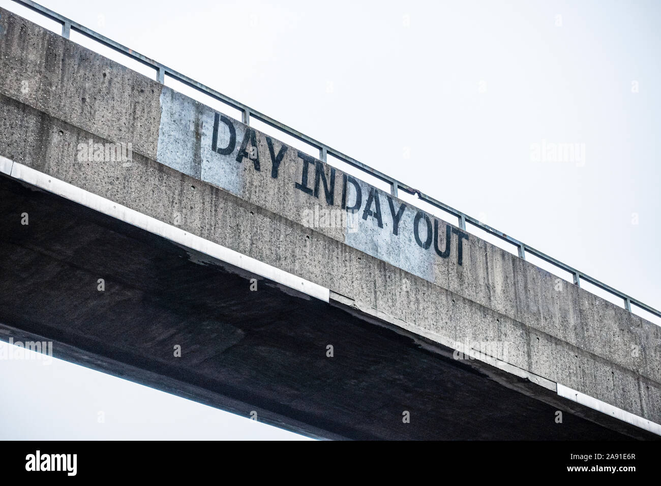 Graffiti on a pedestrian bridge over a road, reading, Day In Day Out, Gateshead, Tyne and Wear, England, UK Stock Photo