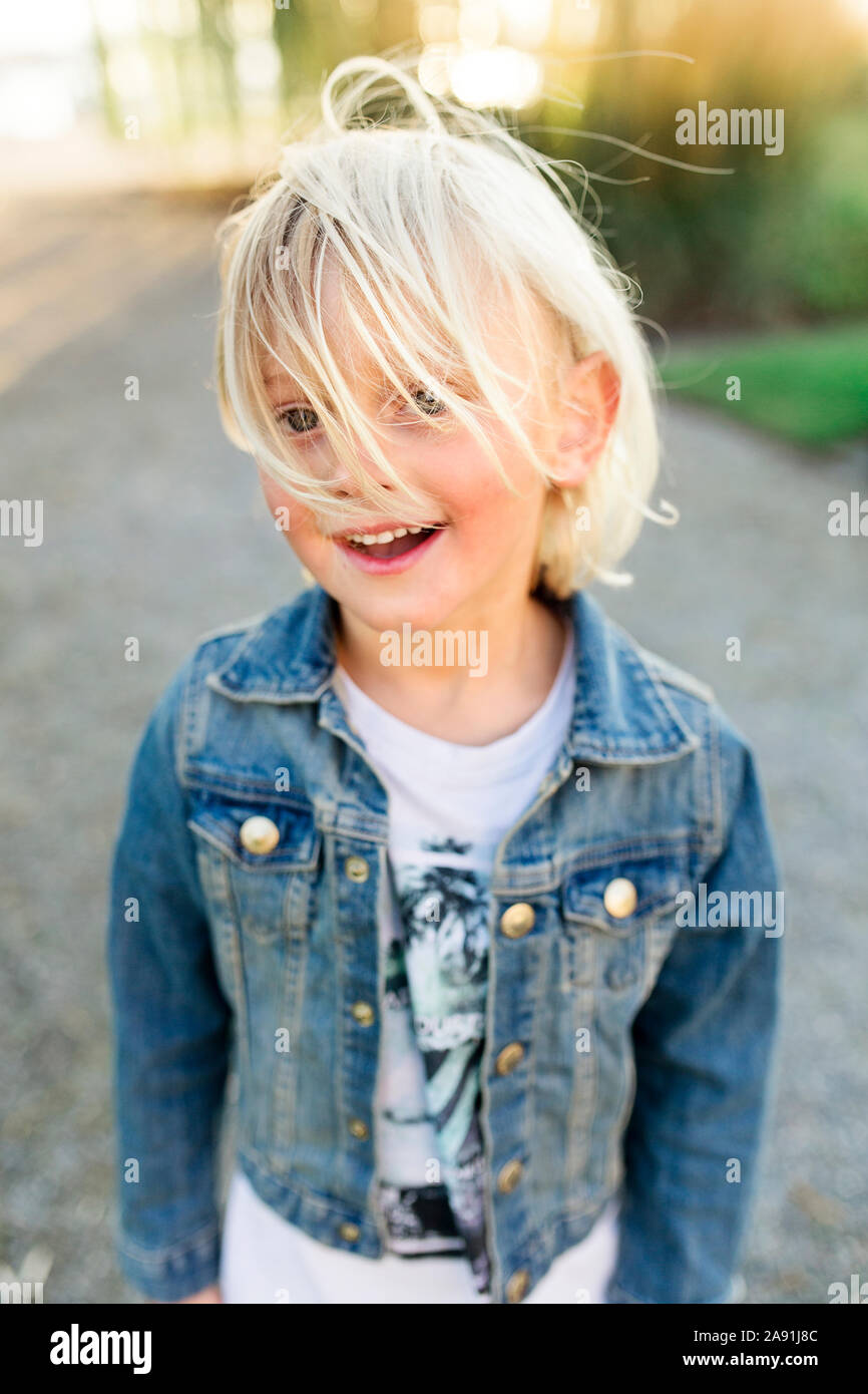 Smiling boy looking at camera Stock Photo - Alamy