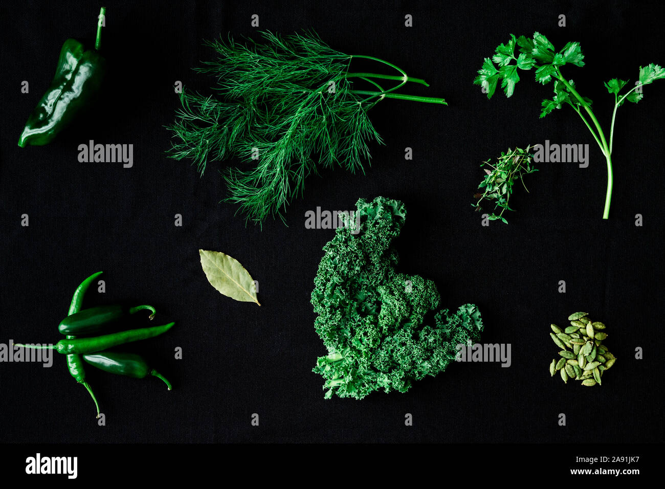 Herbs and spices on black background Stock Photo