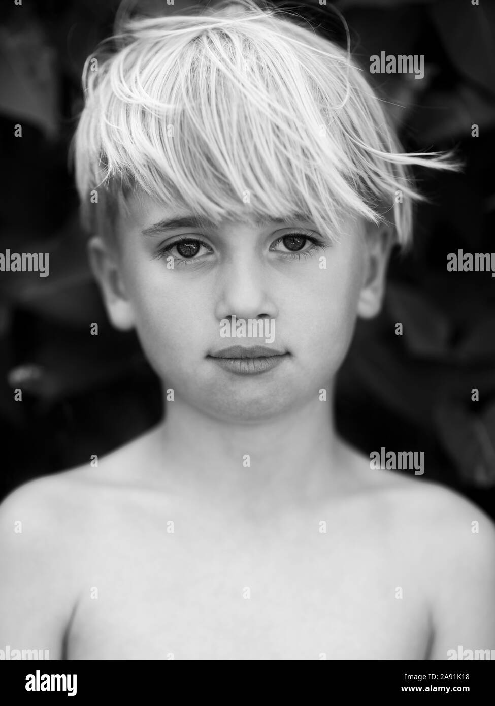 Portrait of boy looking at camera Stock Photo - Alamy