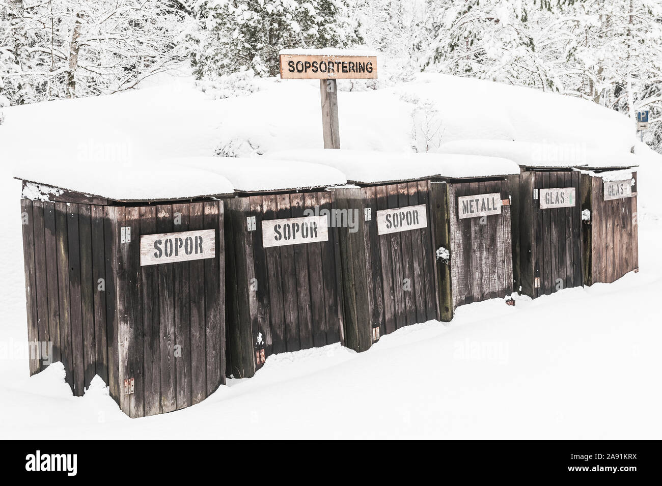 Wooden recycling bins at winter Stock Photo