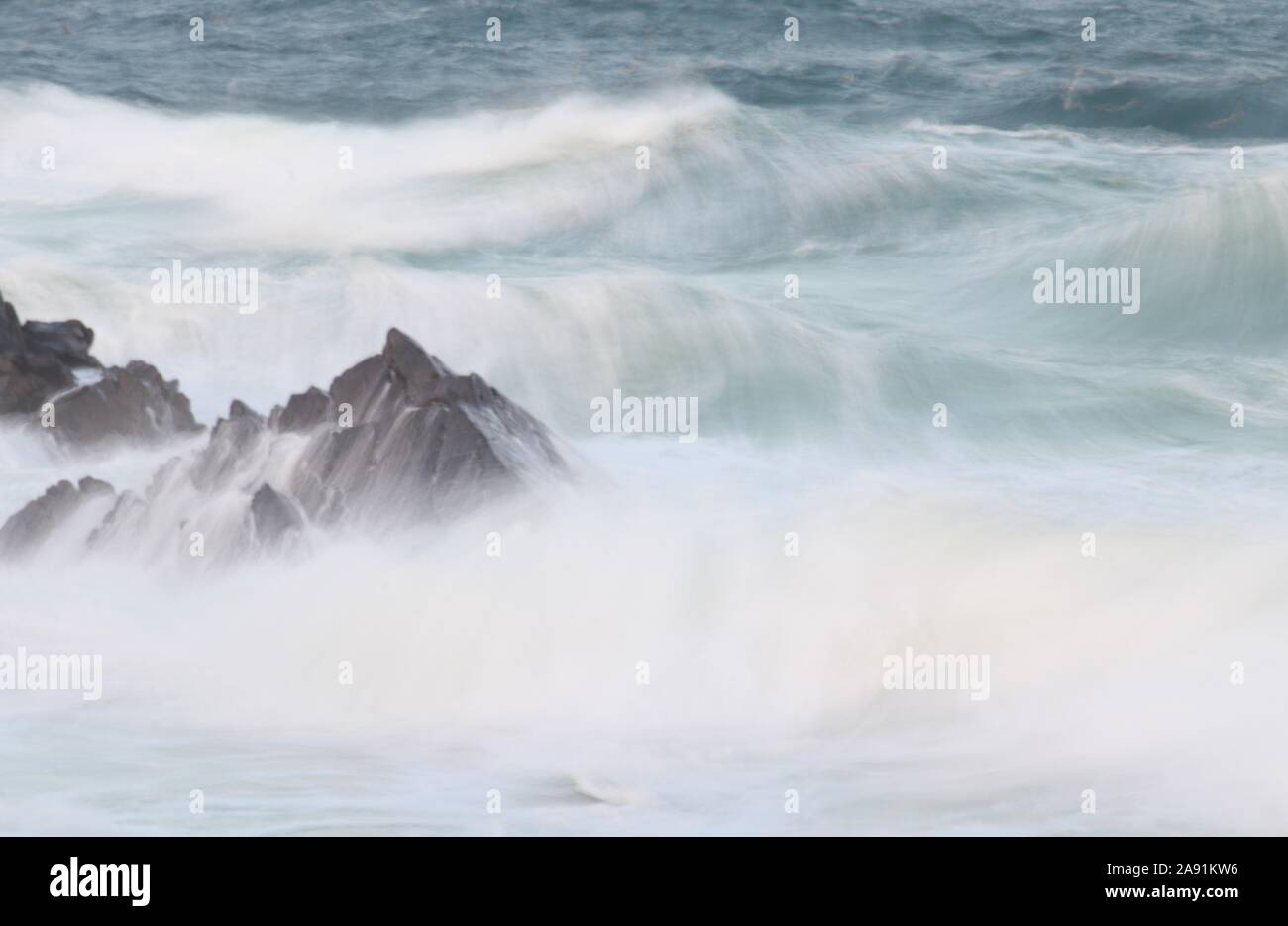Rock and waves Stock Photo - Alamy