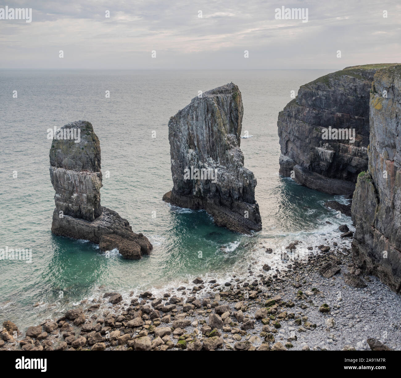 Sea stacks caused by coastal erosion on the shores of Pembrokeshire, Wales. Stock Photo