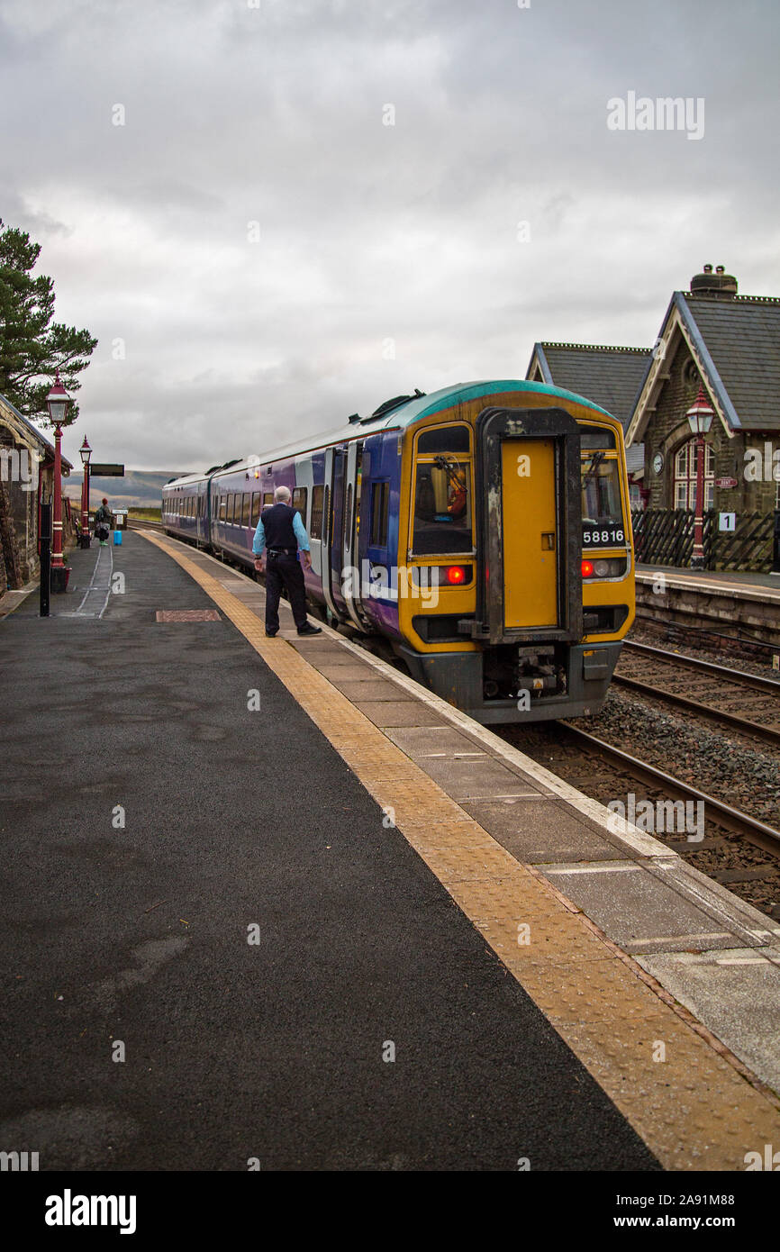 A train stands at Dent Railway Station, Cowgill, South Lakeland