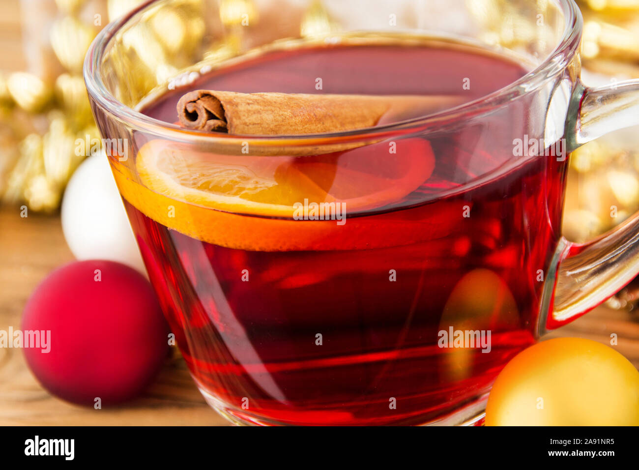 Hot spiced wine and cinnamon Stock Photo