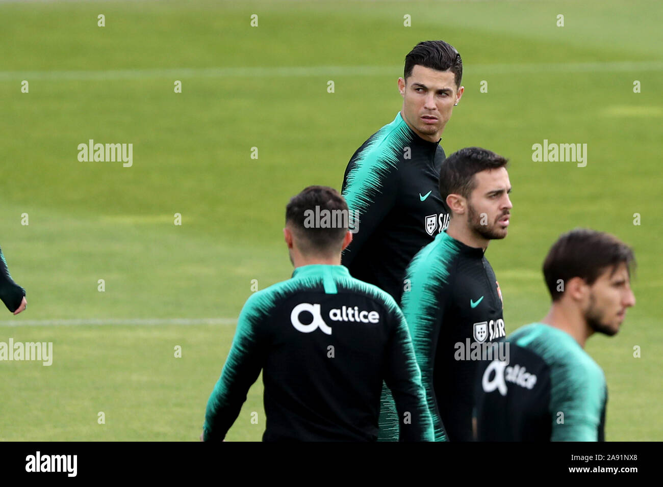 Oeiras, Portugal. 12th Nov, 2019. Portugal's forward Cristiano Ronaldo (top ) attends a training session with his teammates at Cidade do Futebol (Football City) training camp in Oeiras, Portugal, on November 12, 2019, ahead of the UEFA EURO 2020 qualifier match against Lithuania. Credit: Pedro Fiuza/ZUMA Wire/Alamy Live News Stock Photo