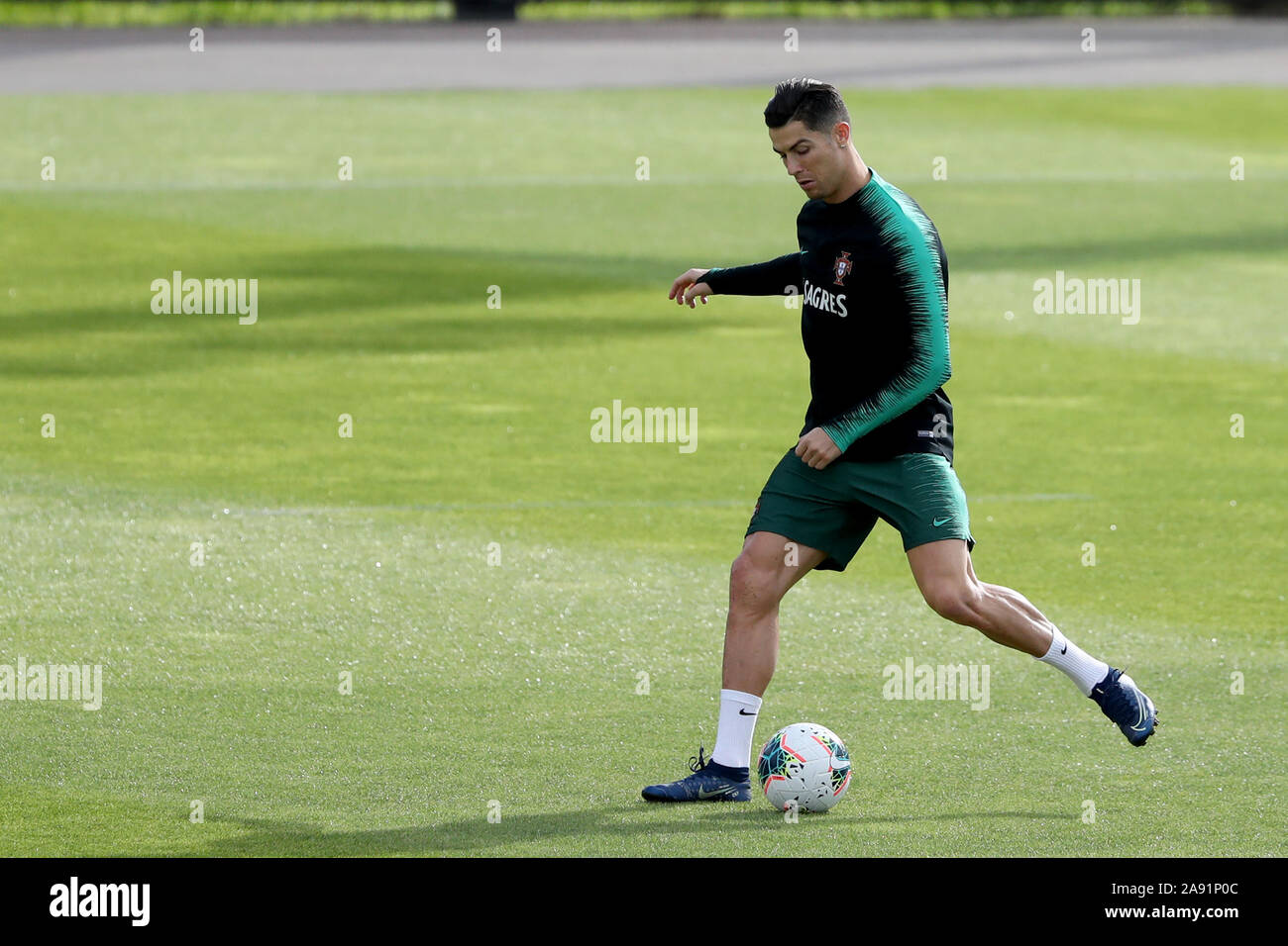 Oeiras, Portugal. 12th Nov, 2019. Portugal's forward Cristiano Ronaldo in action during a training session at Cidade do Futebol (Football City) training camp in Oeiras, Portugal, on November 12, 2019, ahead of the UEFA EURO 2020 qualifier match against Lithuania. Credit: Pedro Fiuza/ZUMA Wire/Alamy Live News Stock Photo