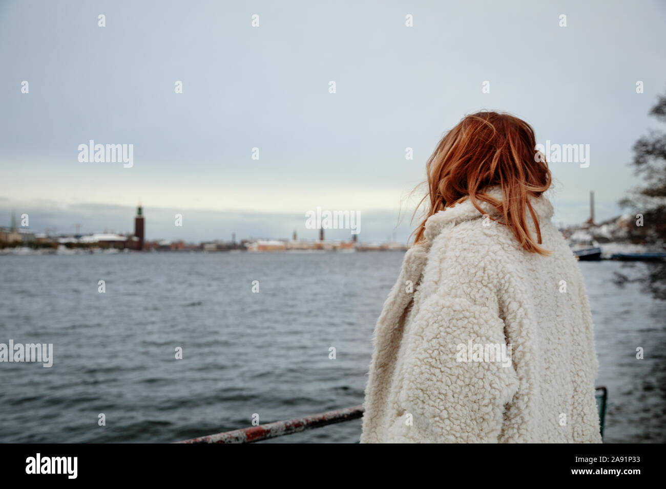 Woman long coat rear view hi-res stock photography and images - Alamy