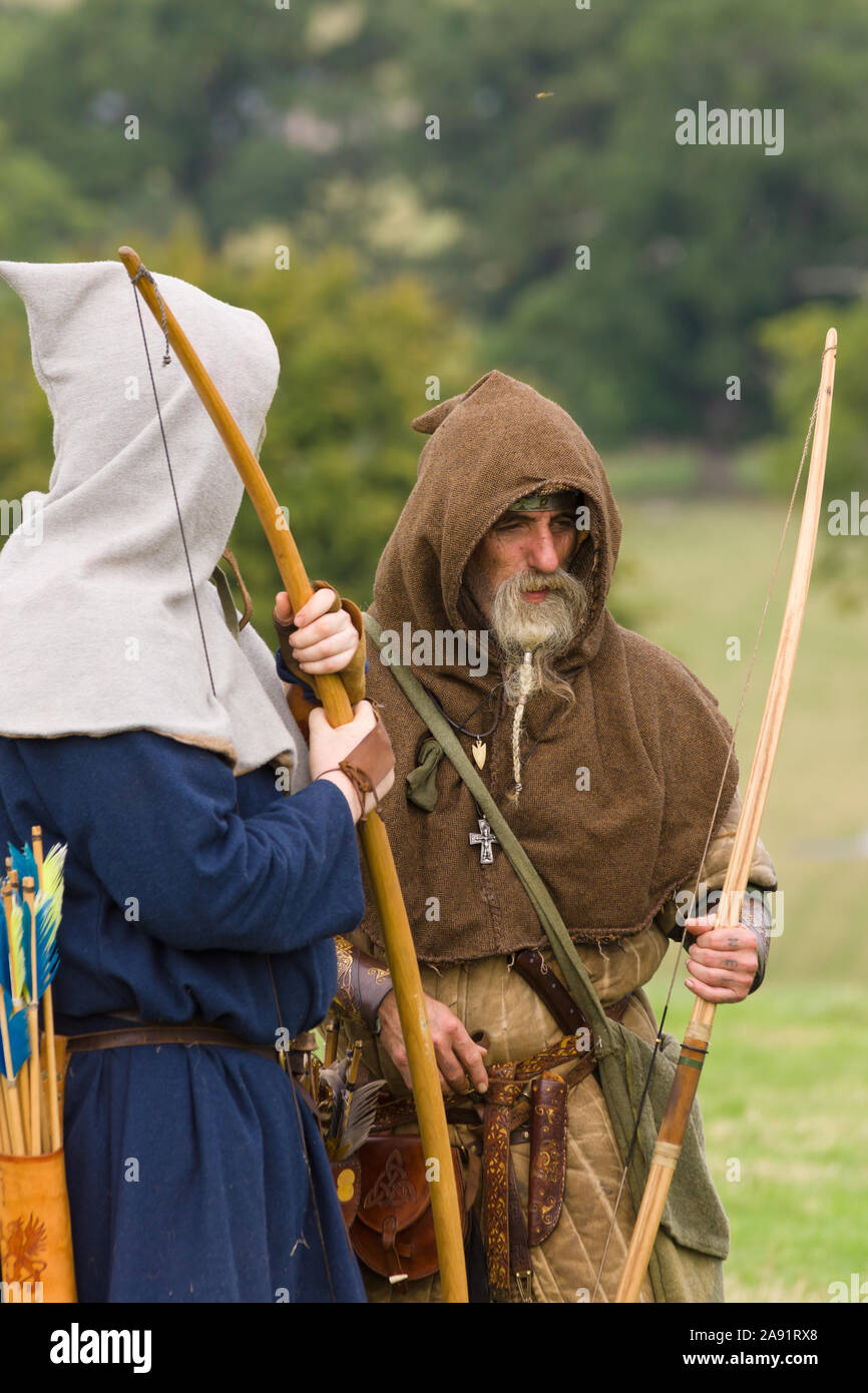 Medieval battle re-enactors dressed as archers belonging to the Cwmwd Ial society re-enacting the battle of Crogen 1165 in North Wales Stock Photo