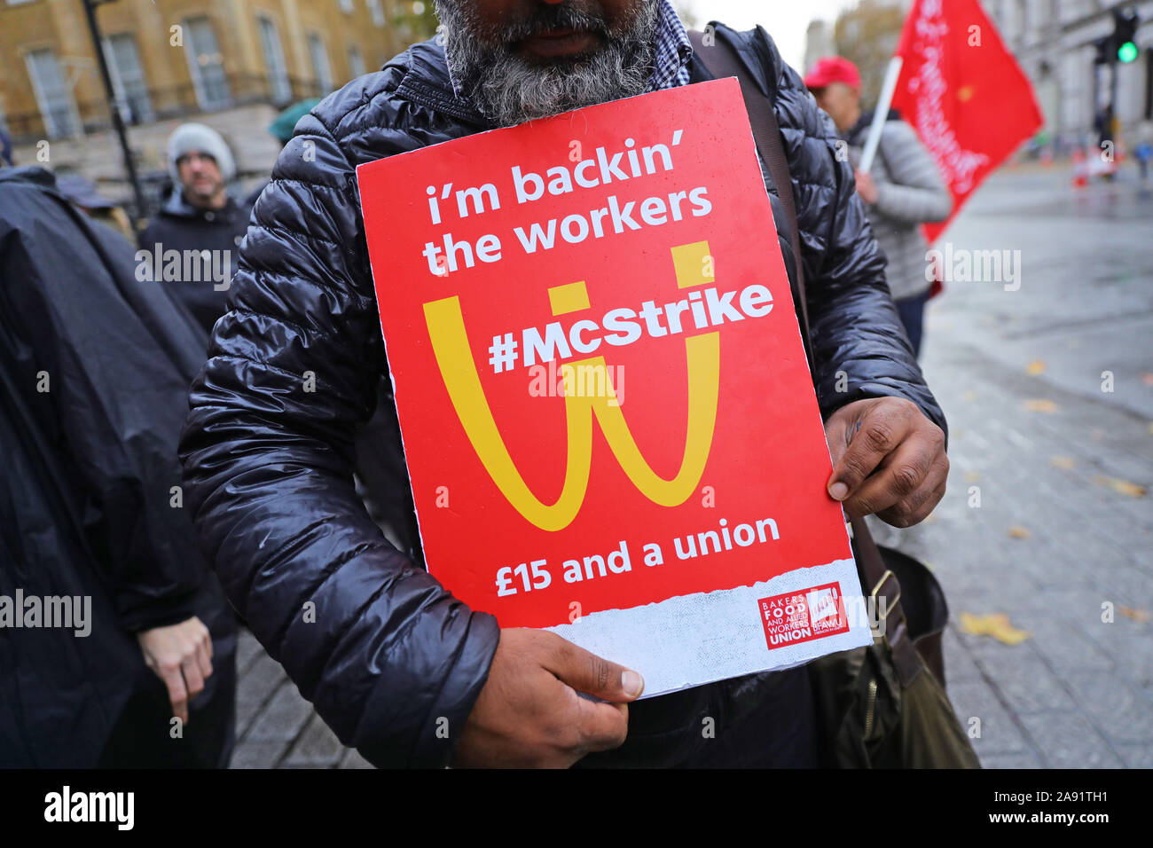 McDonald's workers and demonstrators take part in a protest calling for wages of ??15 an hour outside Downing Street in Westminster, London. Stock Photo