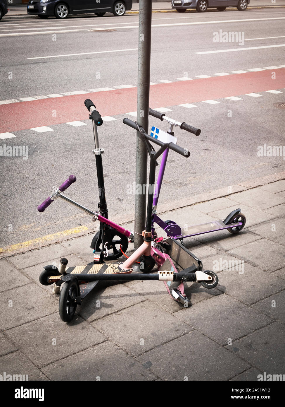Scooters on sidewalk Stock Photo Alamy