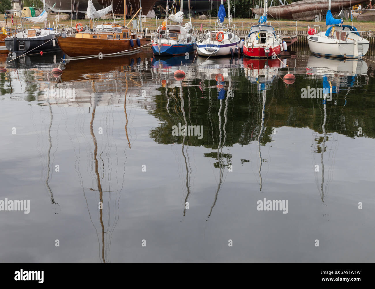 Group of yachts on water in a dock Stock Photo - Alamy