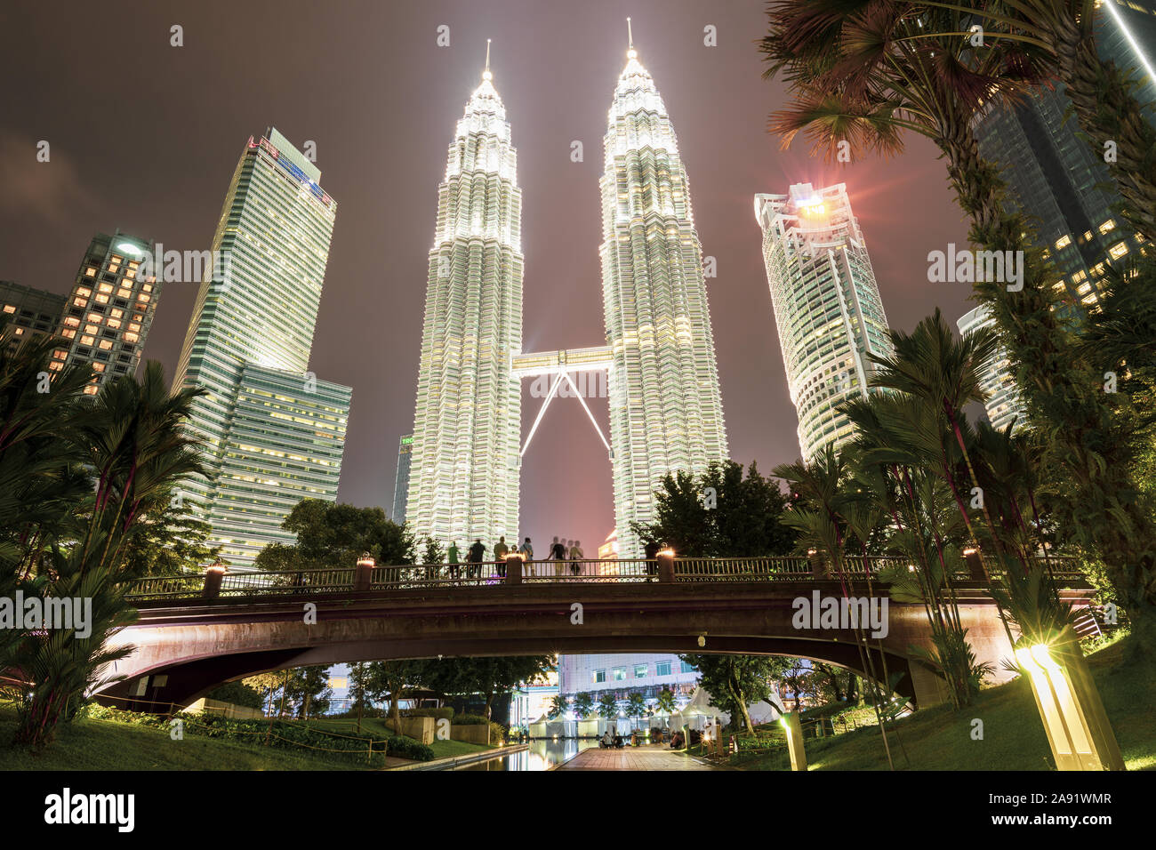 Stunning view of the Petronas Twin Tower illuminated at dusk. The Petronas Towers are twin skyscrapers in Kuala Lumpur. Stock Photo