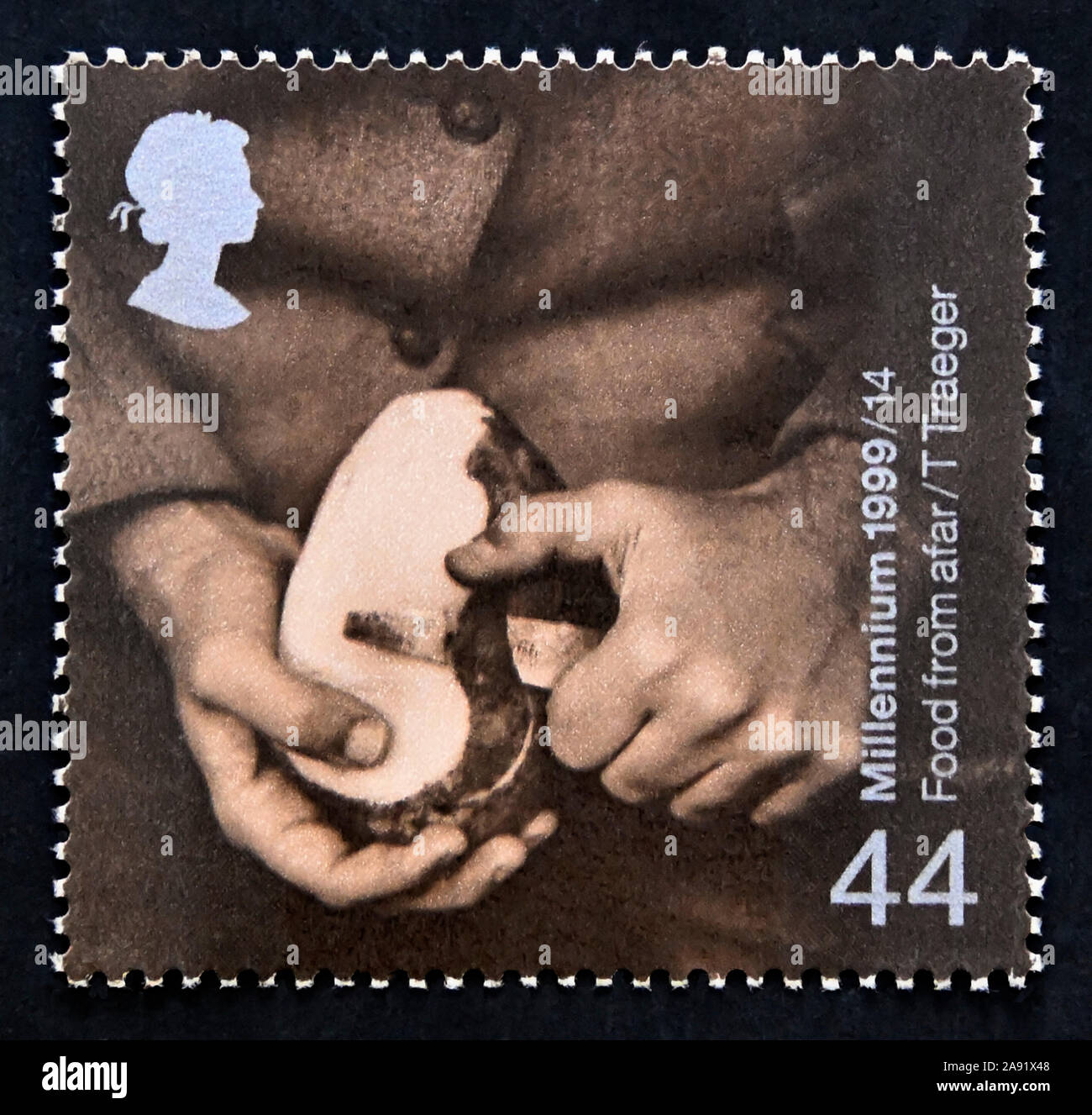 Postage stamp. Great Britain. Queen Elizabeth II. Millennium Series. The Farmer 's Tale. Man peeling Potato (Food imports). 44p. Stock Photo