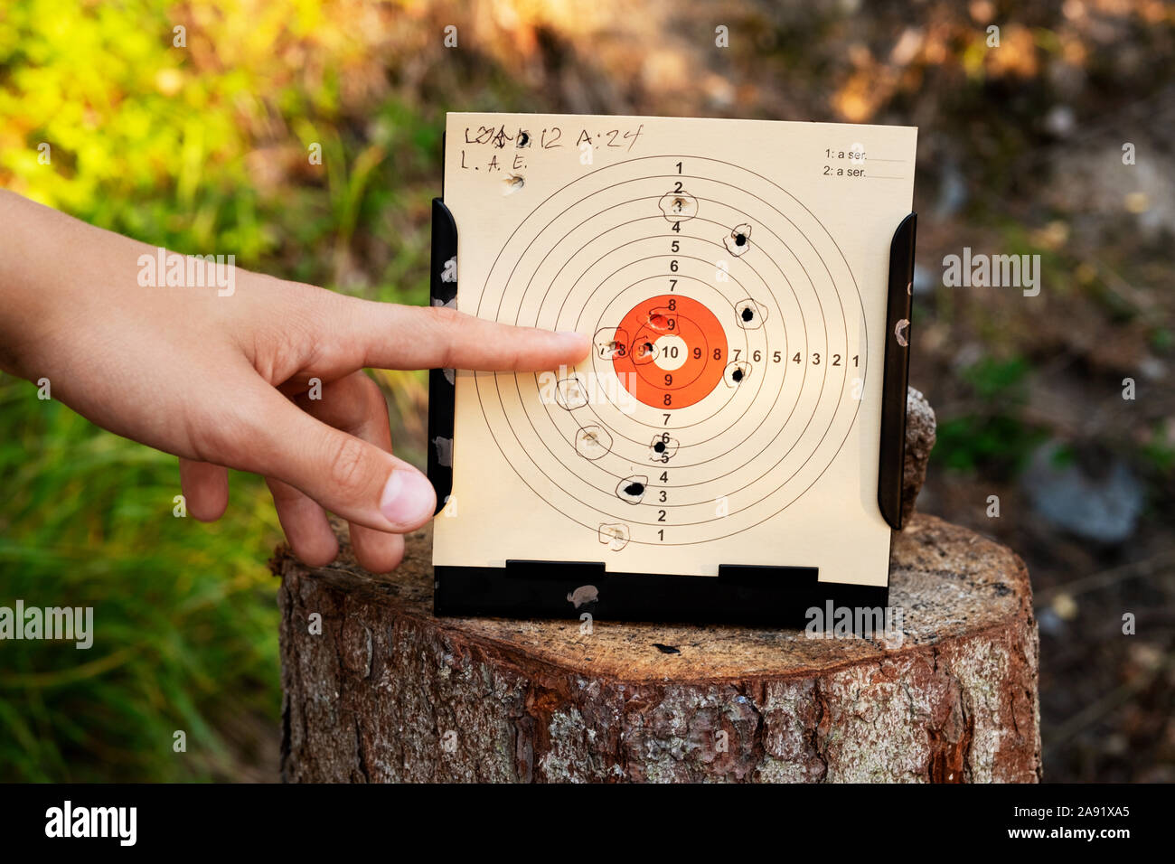 Hand pointing on shooting target Stock Photo Alamy