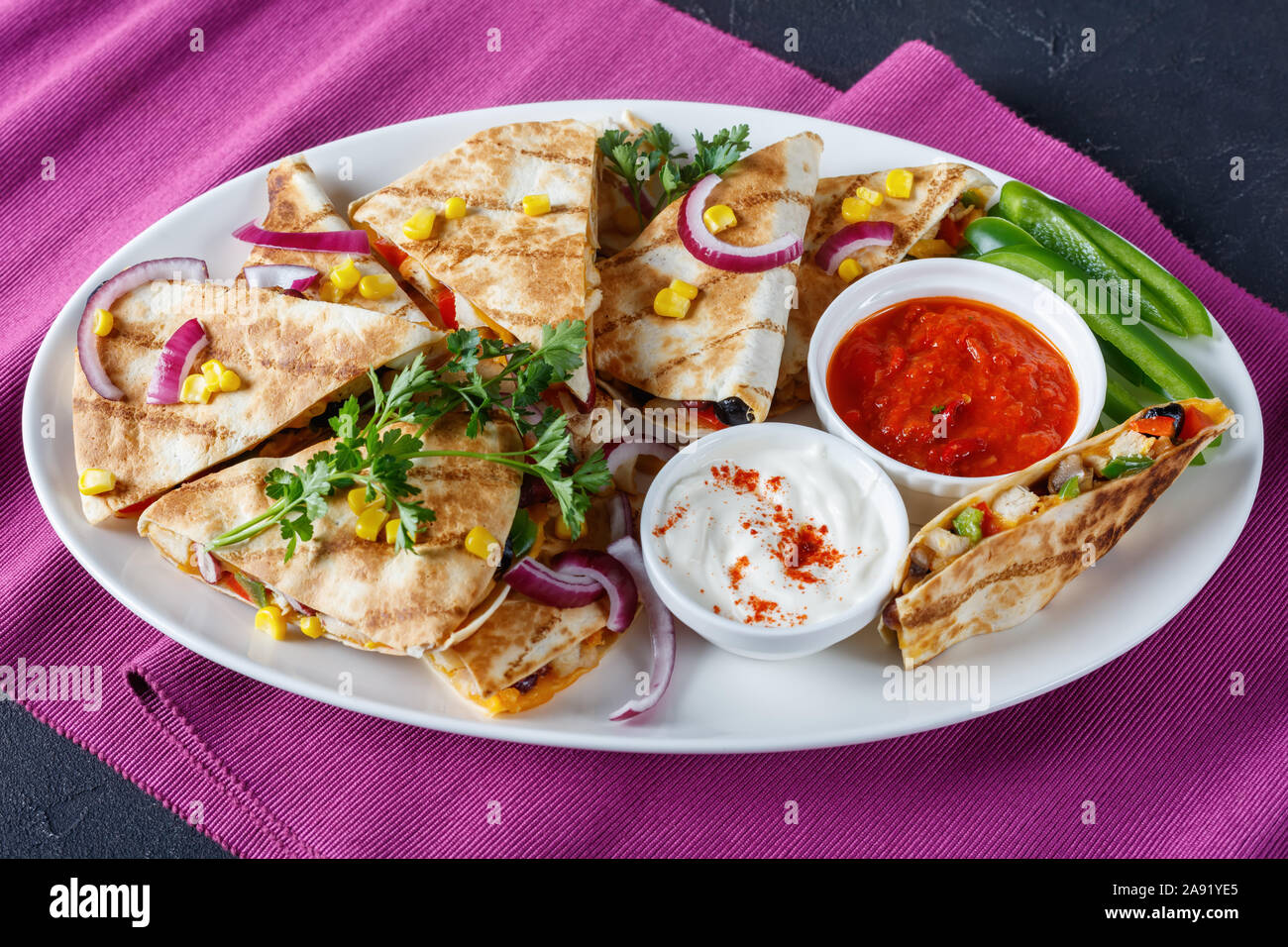 mexican chicken quesadilla with vegetables, corn kernels, shredded