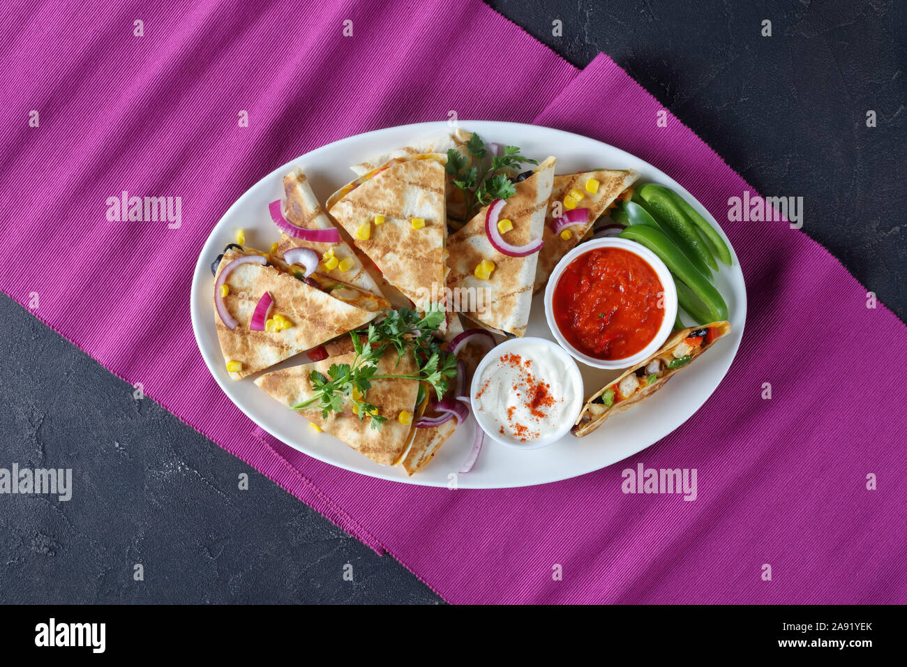 mexican chicken quesadillas with vegetables, corn kernels, shredded