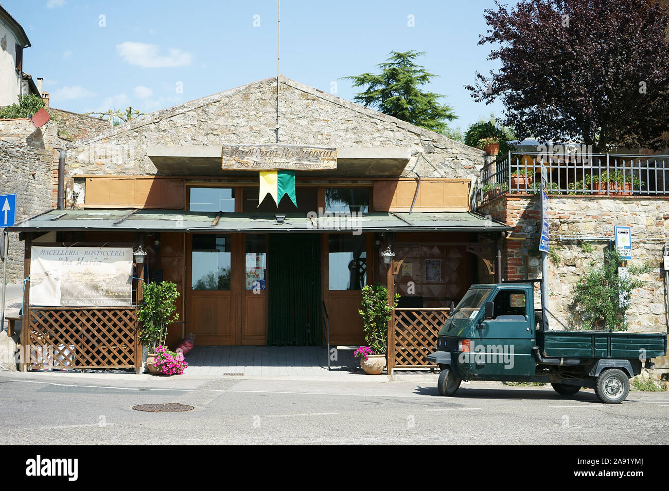Ape car Piaggio near tuscan butcher shop ' Da Maria' in Lucignano in Valdichiana, tuscany, italy Stock Photo