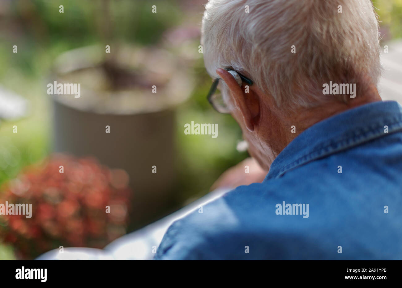 Man with hearing aid Stock Photo