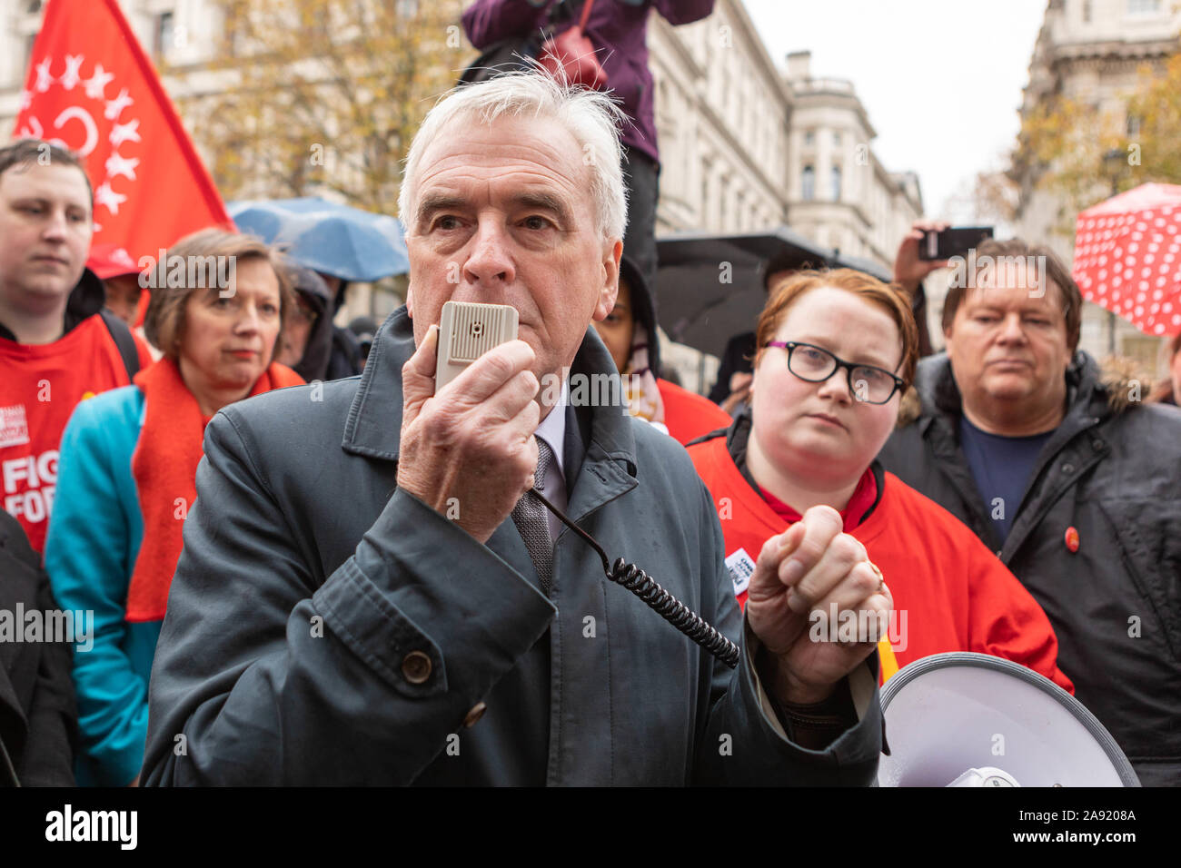 Downing street, Westminster, London, UK. 12th Nov, 2019. Shadow chancellor John McDonnell joins the workers outside Downing Street. Struggling McDonald's workers outside Downing Street, strike for higher wages. Employees are demanding £15 per hour, to end youth rates, a choice of hours of up to 40 hours a week and four weeks notice for shift changes. Penelope Barritt/Alamy Live News Stock Photo