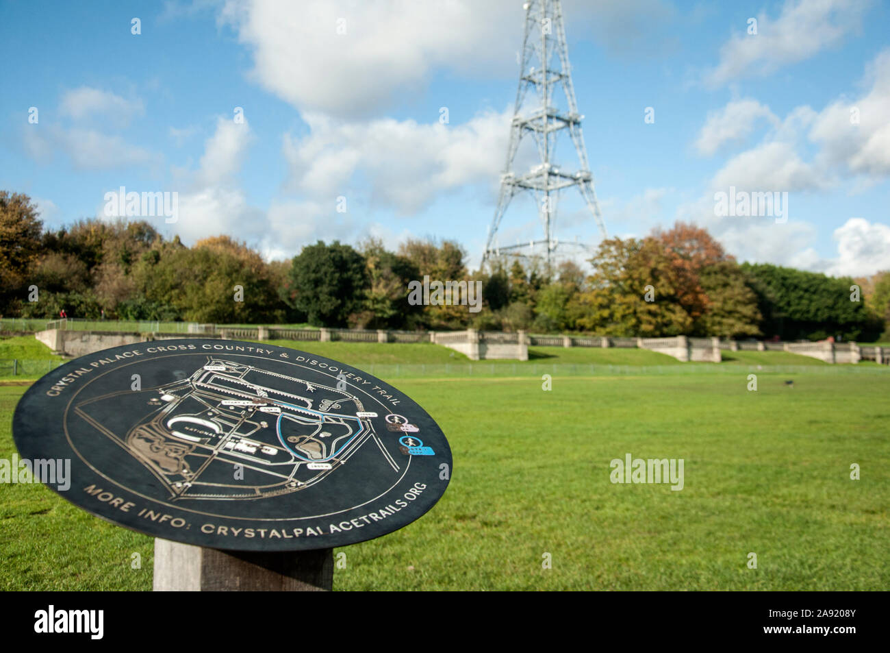 Crystal Palace Cross Country & Discovery Trail sign, with Crystal Palace transmitting station tower and ruins of Crystal Palace visible on the backgro Stock Photo