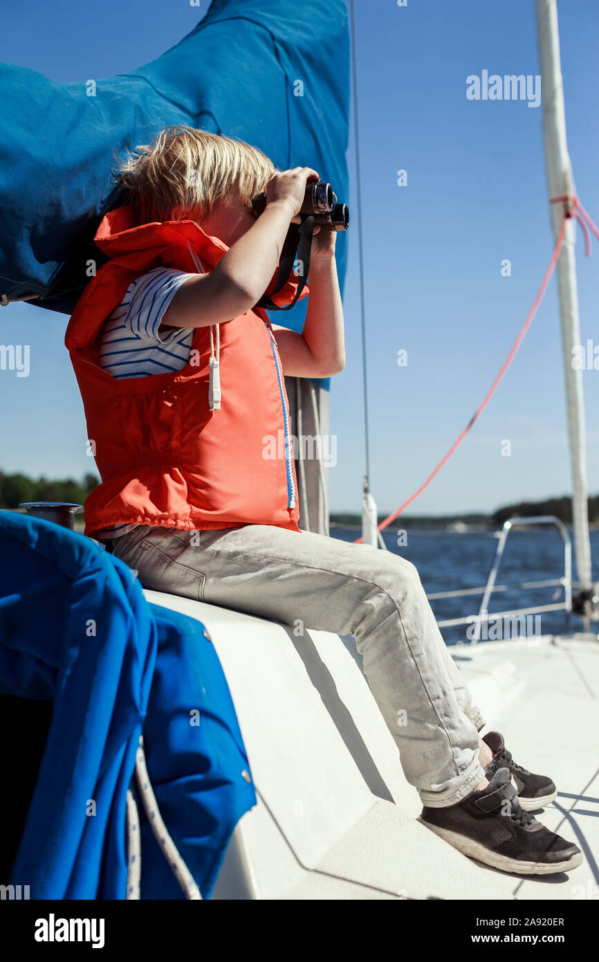 Boy on boat hi-res stock photography and images - Alamy