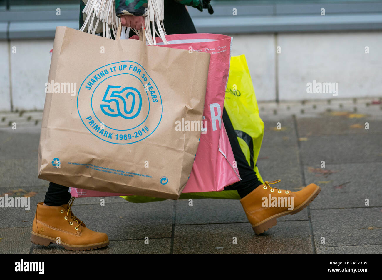 Primark 100% natural biodegradable brown paper women's fashion discount  clothing store reusable shopping bags being carried by shoppers in Preston,  UK Stock Photo - Alamy