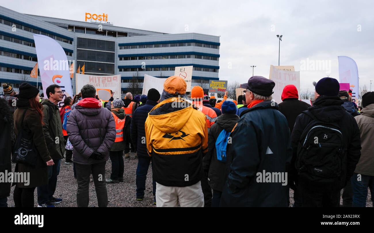 Post strike in Finland. Posti Group headquarters in the background and Posti strikers march and to protest. Finland’s postal workers call strike Stock Photo
