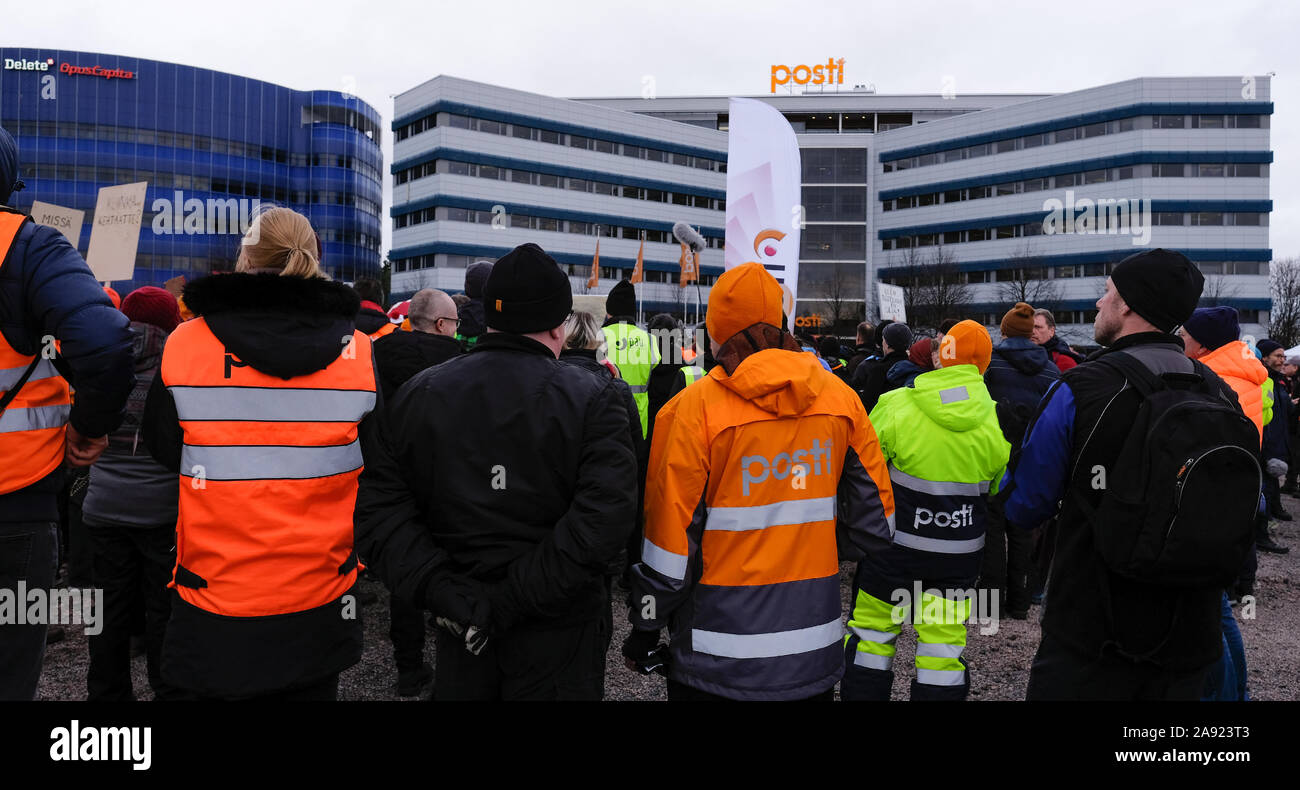 Post strike in Finland. Posti Group headquarters in the background and Posti strikers march and to protest. Finland’s postal workers call strike Stock Photo